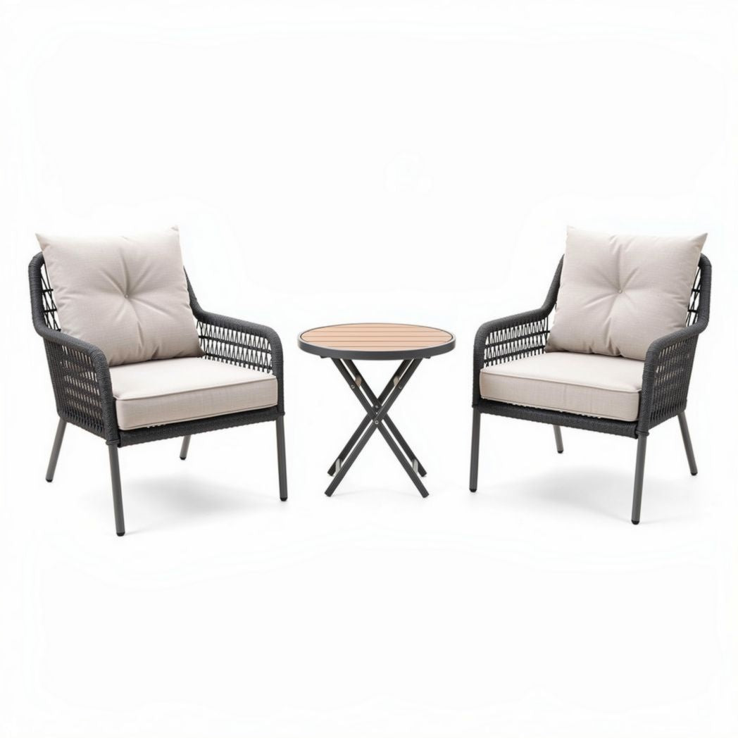 Woven rattan outdoor seating set with cushioned chairs and round table